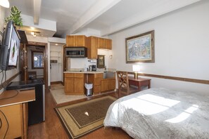Separate suite with queen bed and kitchenette.