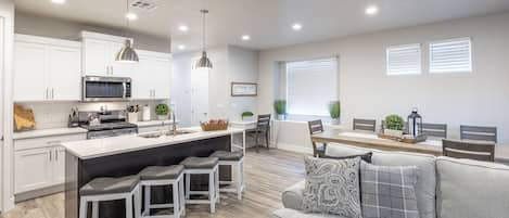 Kitchen Island - The Kitchen Island comfortably seats 4 adults and creates a great space for serving and preparing meals.