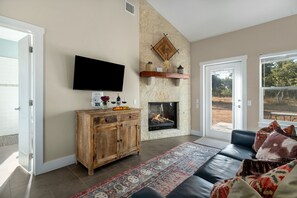 Cozy up to the fireplace while watching your favorite show.
