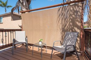 our secluded deck off the 1st bedroom is a great place to have a drink and soak in the sunset. 