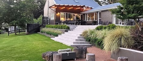 The firepit & terrace at dusk
