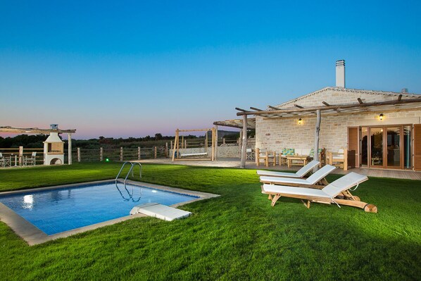 The pool and garden are delightful at night!