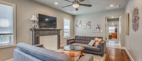 Inviting living room with ample seating and smart TV