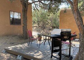New: an outside patio under the trees with barbeque for your exclusive use