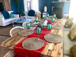 Dining/living room with ocean views and propane fireplace. 