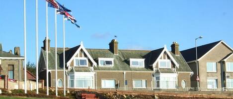 Exterior view from Moray golf club. To the immediate right is BeachView Apartment, our self catering property.