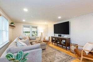Living room with 85" smart TV