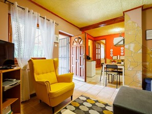 Furniture, Property, Couch, Table, Orange, Building, Interior Design, Living Room, Yellow, Chair