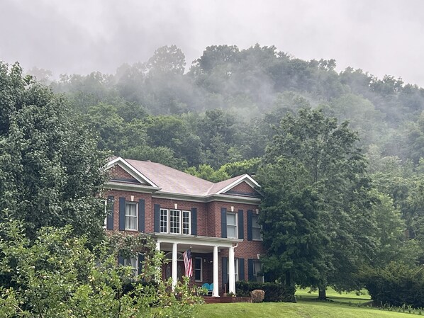 Country Cove on hill top engulfed in clouds.