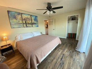 Master bedroom with king size purple mattress. Faces river with walkout. 