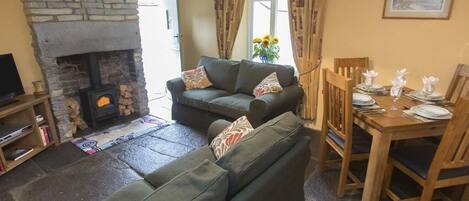 Cosy sitting room with wood burner