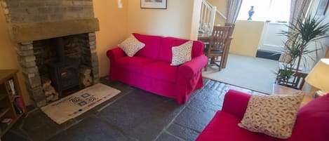 Cosy sitting room with wood burner