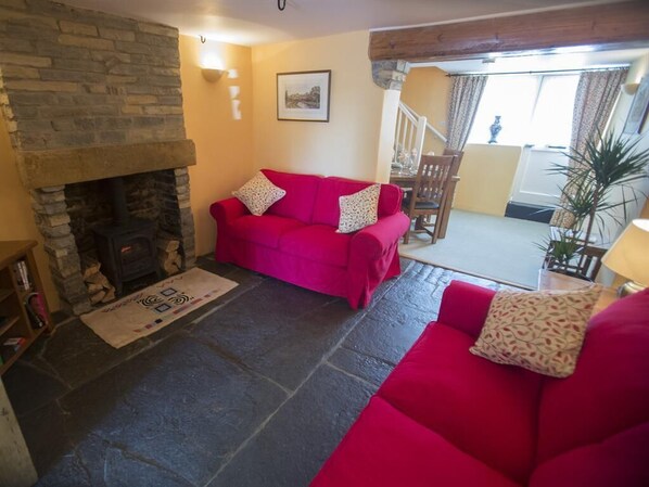 Cosy sitting room with wood burner