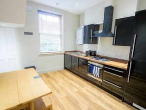 Kitchen used by rooms 11, 12 and 13. Direct access to the garden