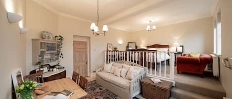 The main room with deluxe Edwardian double bed on the upper mezzanine.