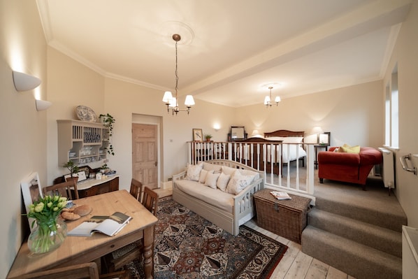 The main room with deluxe Edwardian double bed on the upper mezzanine.