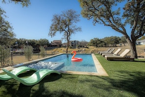 Pool area with astroturf. Plenty of room to play cornhole