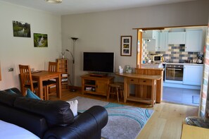 New layout, larger comfy sofa and table and chairs for eating in