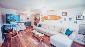 Family Room Overview - AC Unit, Ceiling Fans, Fun and Colorful local Hawaiian inspired decor