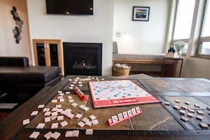 Pick out a game and sit by the fire for family game night.