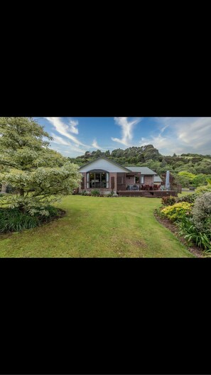 Rear view of house, lots of garden to relax in