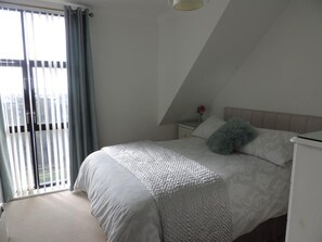 Second bedroom with double bed with sea views (locked if two people sharing one bedroom)