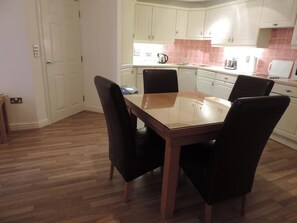 Dinning area open plan kitchen with sea views