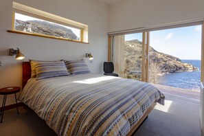 Bedroom with king-size bed and sliding glass door