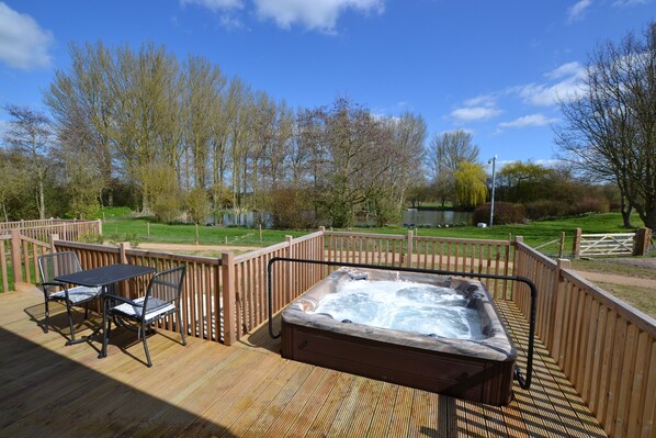 Private veranda with hot tub, BBQ & lake view