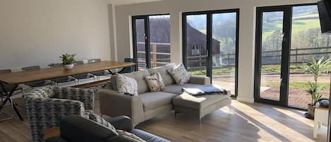 Sugar Loaf lounge enjoys fantastic views across the farm and Glyn Valley.