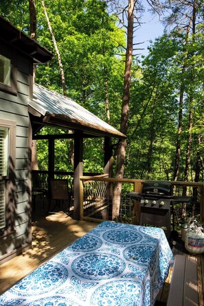Uncovered porch on the side of the house for grilling. Serene views of the woods and river. 