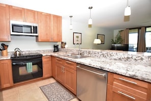 Completely renovated kitchen is stocked with everything you need for cooking.