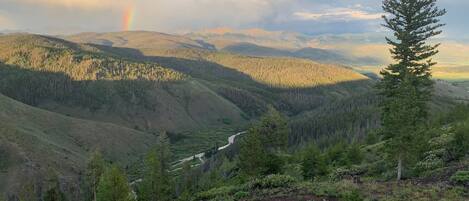 Views of mountain peaks, Fraser River, and fire pit from our deck