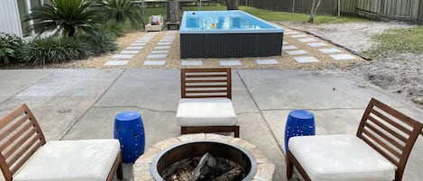 Enjoy the backyard space with a Firepit and large pool spa.