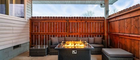 Comfortable outdoor Patio with Fire Table and Propane Grill 