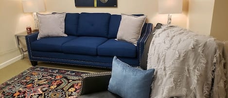 Living room with sofabed and recliner