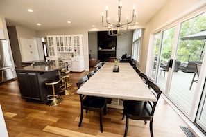 Large open concept kitchen, dining and living rooms