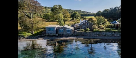 Mulroe Boathouse on the left with the contemporary extension