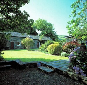 Mulroe House and its setting in the walled garden next to the sea.