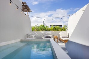 Take a dip in the pool or hang out nearby on a comfortable beds