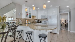 Updated kitchen with countertop bar for an additional seating