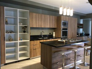 Fully equipped kitchen with modern GE Profile appliances 