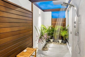Both rooms have a large outdoor shower