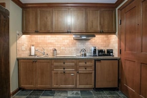 Kitchenette, microwave, dishwaster and fridge (larger fridge in closet) 
