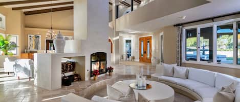 The cozy conversation pit and fireplace in the great room