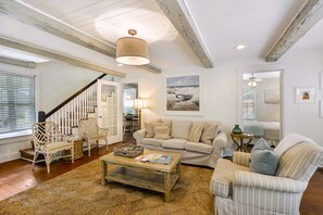 Bright Living Room with Smart TV and Plush Sofa - The heart of the home—this St. Simons vacation rental living room is open, inviting, and full of natural light, with plenty of space to relax after a beach day.