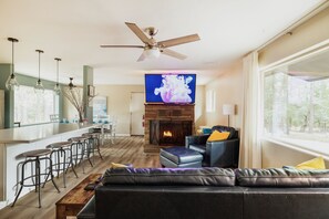 65" TV, wood burning fireplace. Lots of seating options