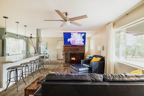 65" TV, wood burning fireplace. Lots of seating options
