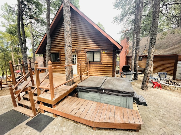 New paver patio with privacy fence between cabins, new paver walkway.