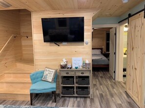 Living Room with Spectrum TV streaming package and WiFi and Welcome guide
